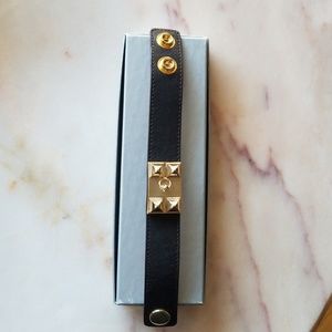 Black cuff bracelet with gold hardware